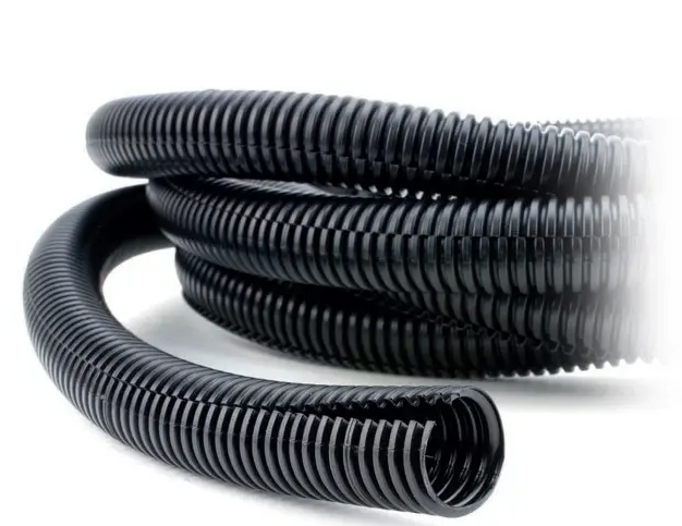 Black plastic flexible split conduit for cable protection and organization in automotive and industrial wiring projects.