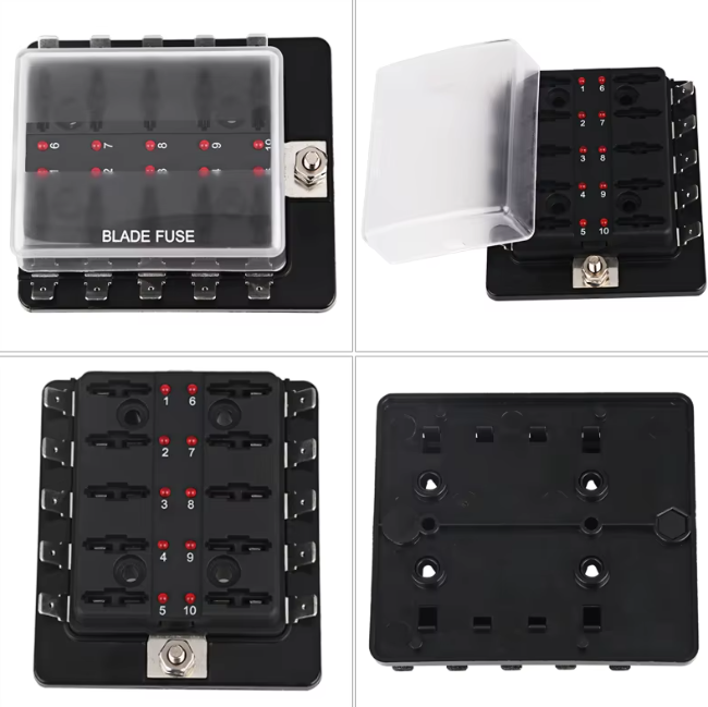 Black blade fuse box with multiple fuse slots on a white background