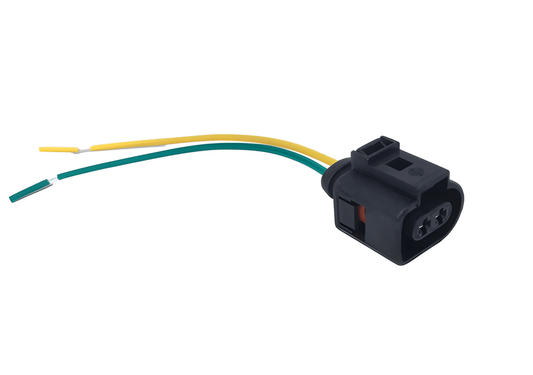 Profile view of a single 2-pin male marker light plug showing the internal connection pins and pre-stripped yellow and green pigtail wires for 12V/24V truck electrical systems.