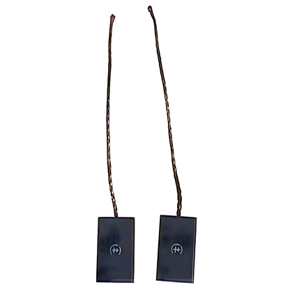 Two black alternator brushes with sticks on a white background