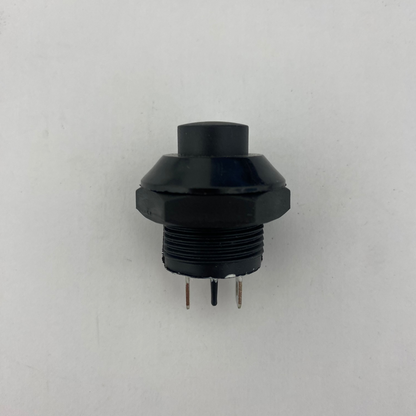 Black mechanical push button momentary switch on a white background
