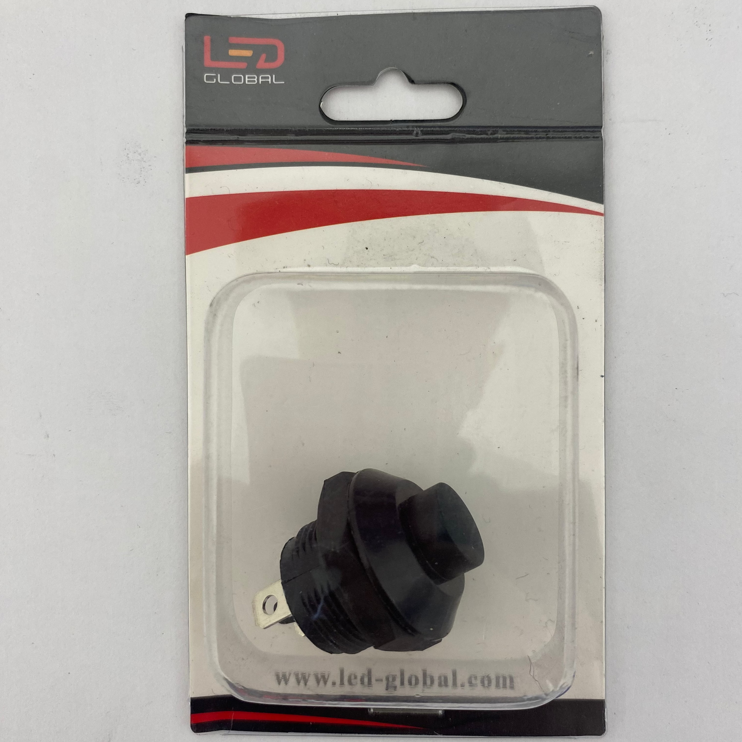 push button momentary switch in clear plastic packaging with LED Global branding on a white background
