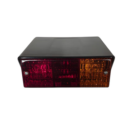 Car taillight with red and orange lenses on a white background