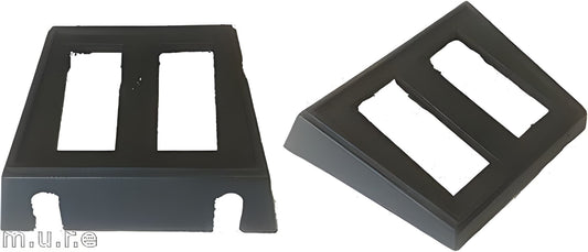 Two black plastic brackets on a white background
