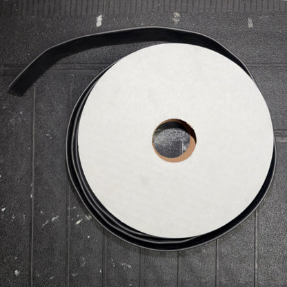 Top-down view of a mini reel spool wrapped with black heatshrink tubing.