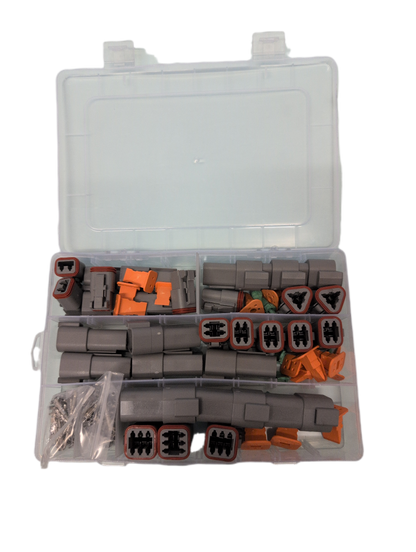 An open clear plastic organizer case filled with multiple deutsch connectors & terminals