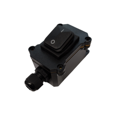 A black plastic electrical switch module with a rocker switch and a threaded connector, isolated on a white background.