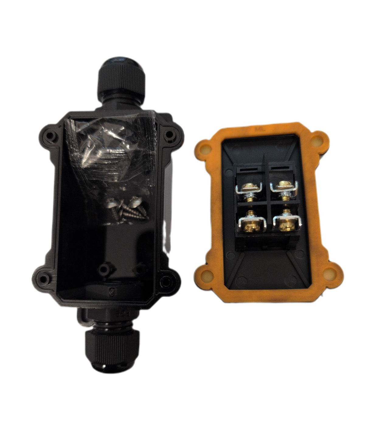 A black waterproof electrical junction box shown open, with the front cover removed and the internal terminal connectors visible, alongside a small bag of mounting screws on a plain white background.