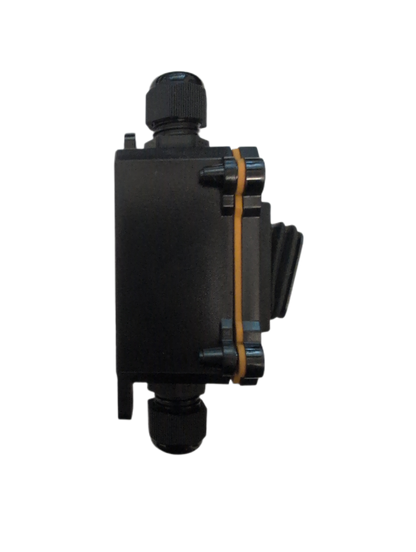 A black plastic electrical junction box with a threaded connector on top and bottom, secured by a tan rubber gasket, shown against a plain white background.