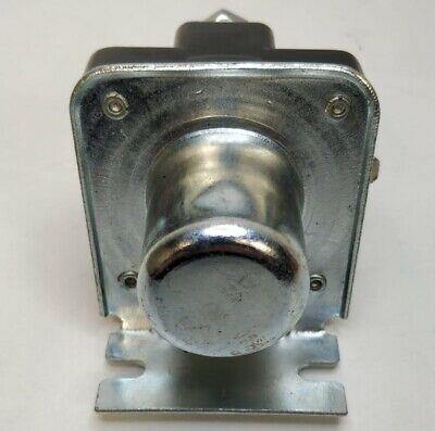 rear view of a starter motor solenoid on a white background 